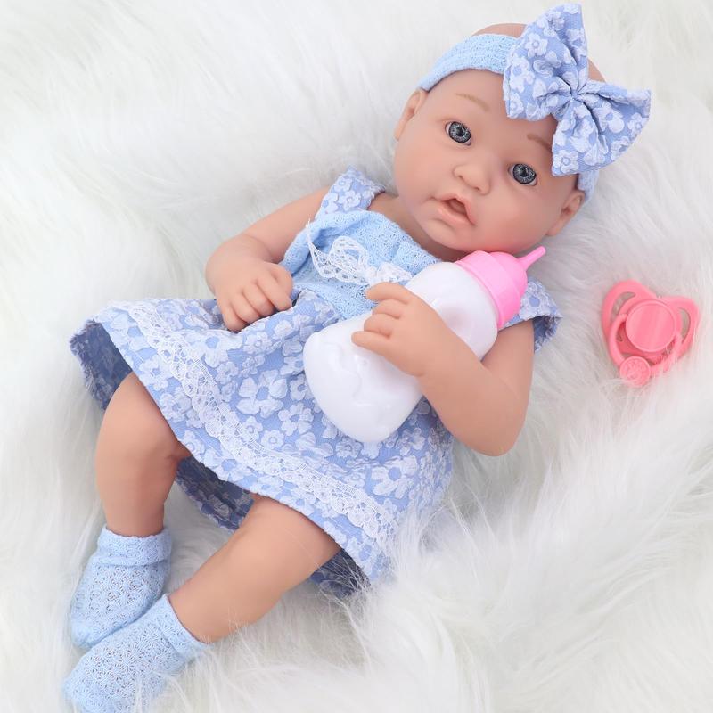 14 inch baby doll with accessories including clothes bottles, diapers, pacifiers