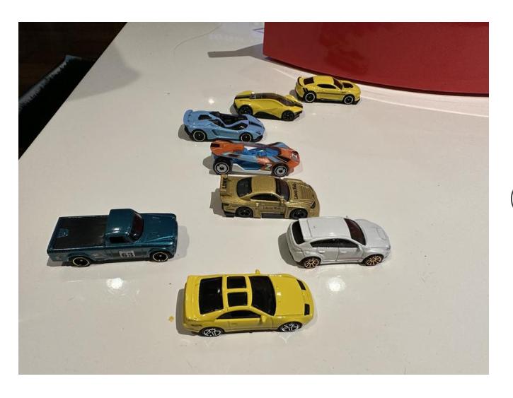 Hot Wheels Set of 8 Basic Toy Cars & Trucks in 1:64 Scale Including 1 Exclusive Car, Styles May Vary, Items May Not be Pictured